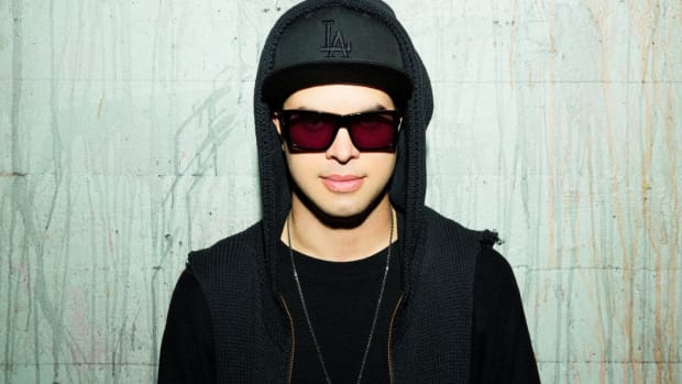 A color press photo of DJ/producer Datsik (real name Troy Beetles).