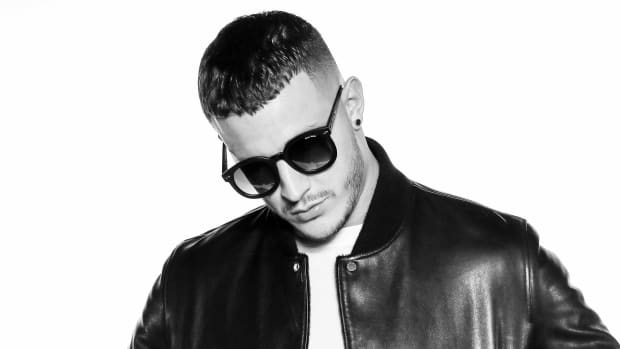 A black-and-white head shot of DJ Snake.