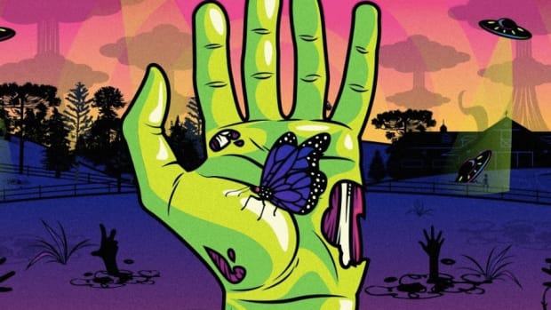 Daybreak Festival zombie hand with butterfly graphic.