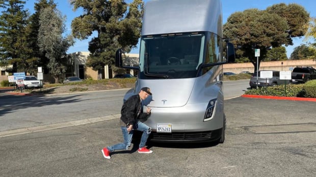 deadmau5 (real name Joel Zimmerman) standing in front of a Tesla Semi truck.