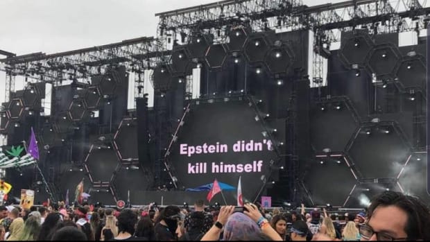 "Epstein didn't kill himself" displayed on the screen at the end of ATLiens' set at EDC Orlando.