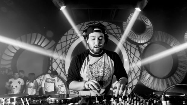 Black-and-white photo of EDM DJ/producer Deorro during a performance.