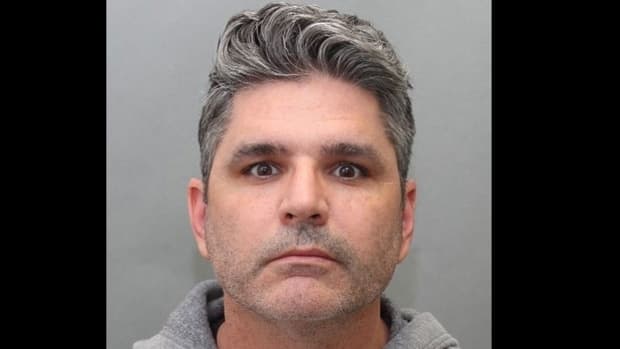A mugshot of 43-year-old Christopher Pulleyn via Toronto Police Service.