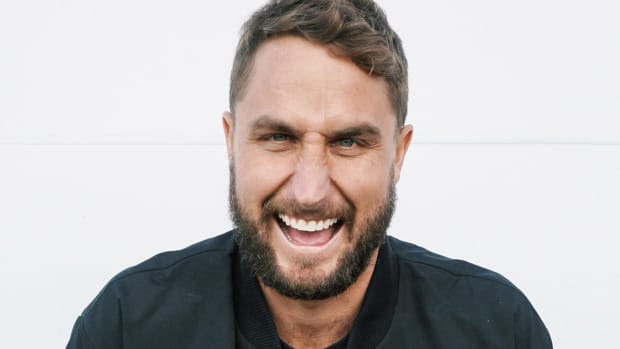 A head shot of Australian DJ/producer Paul Fisher laughing or making a funny face.