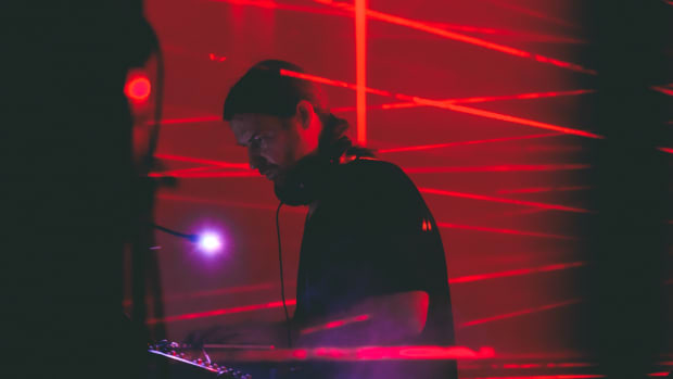 aphex twin with red lasers behind him