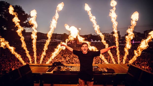 Martin Garrix stage shot with pyrotechnics.