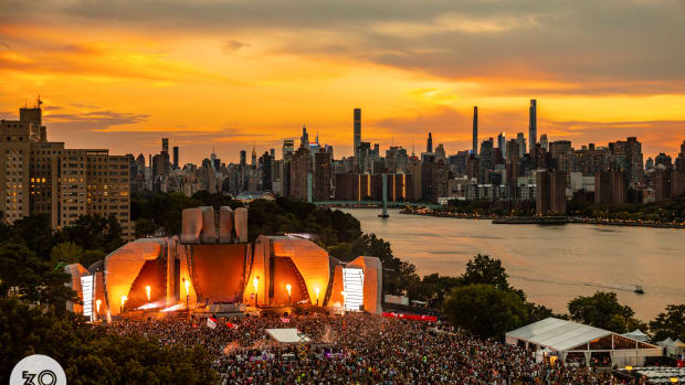 Electric Zoo's main stage against the New York skyline at sunset