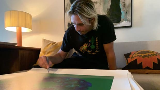 Flume signing art for Soundwaves Art Foundation