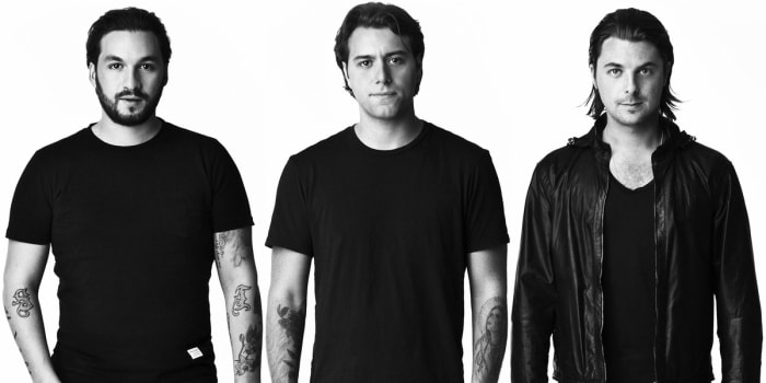 Black and white photo of Swedish House Mafia members Steve Angello, Sebastian Ingrosso and Axwell.