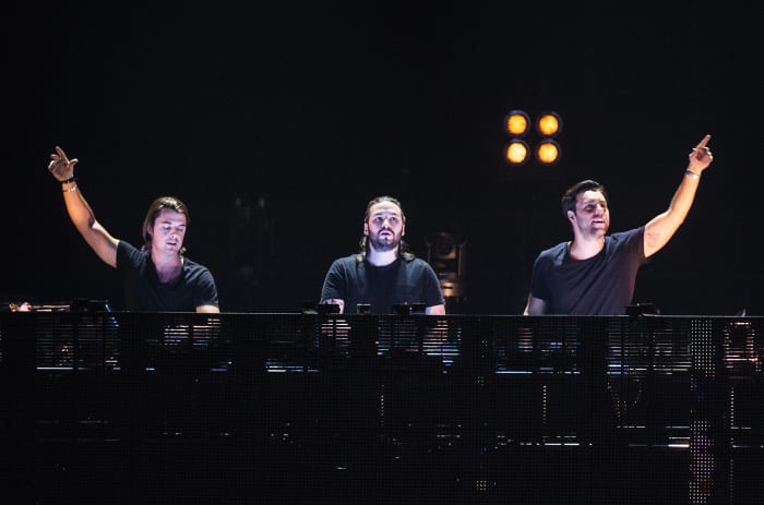 Swedish EDM trio Swedish House Mafia during a DJ performance.