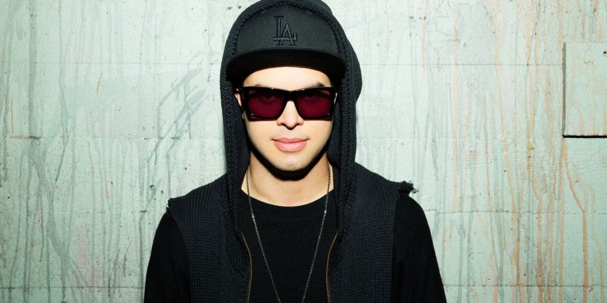 A color press photo of DJ/producer Datsik (real name Troy Beetles).