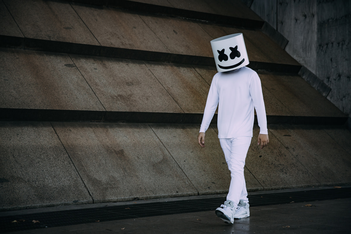 Photo of anonymous DJ/producer Marshmello walking.