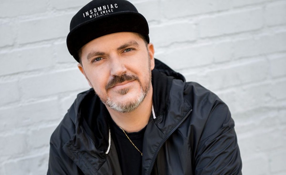 A color head shot of Insomniac Events founder Pasquale Rotella wearing a black hat and jacket.