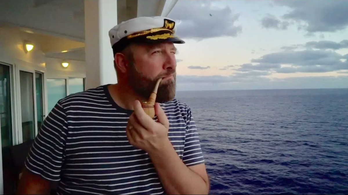 San Francisco DJ/producer Claude VonStroke smoking a corncob pipe at cruise ship festival Holy Ship!.
