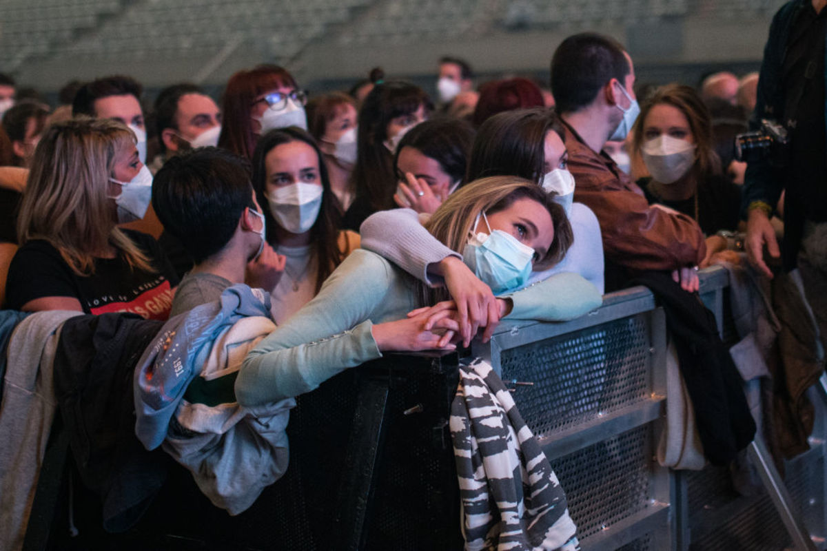 Two attendees embrace at Barcelona’s Palau Sant Jordi, where an experimental concert took place to examine the effectiveness of social distancing.