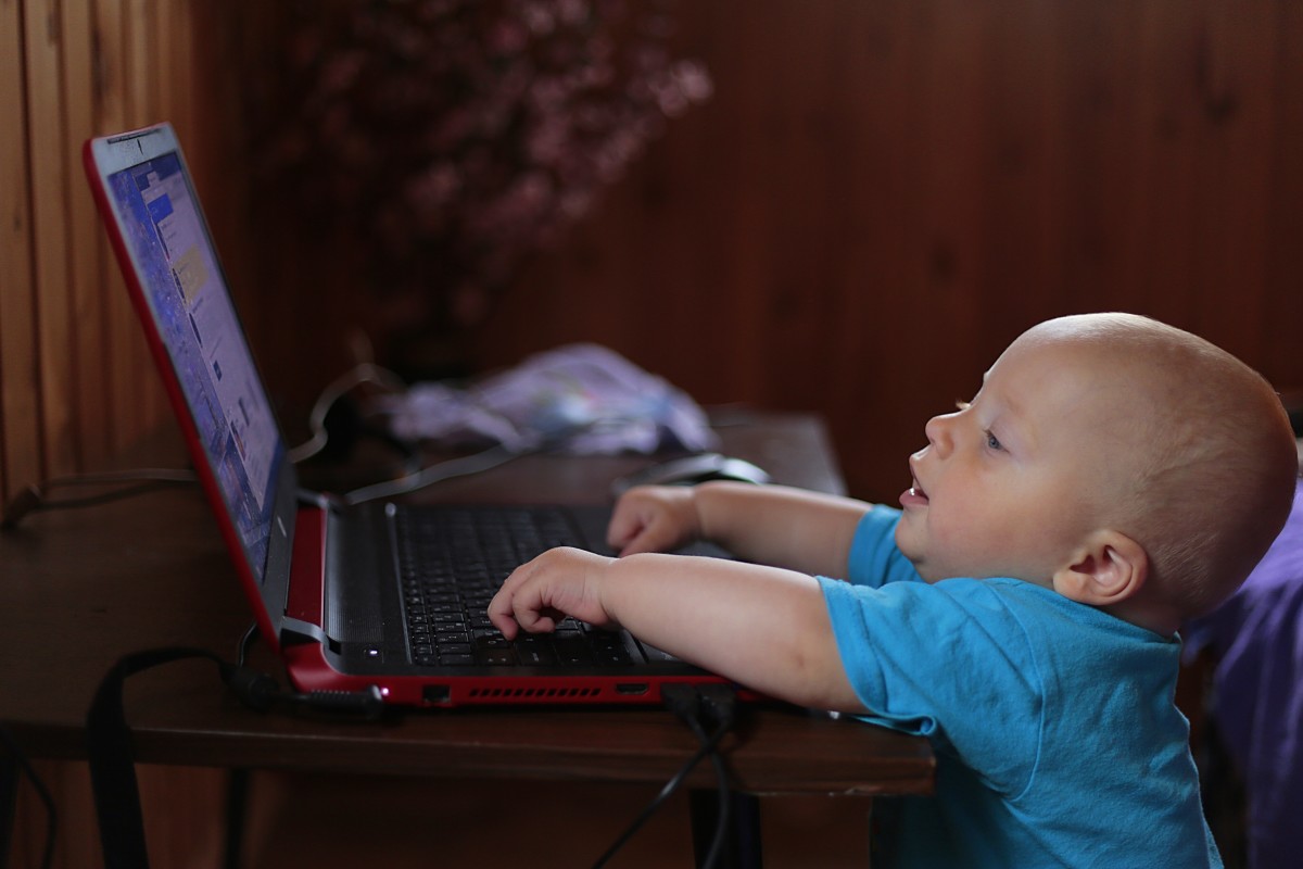 baby in front of laptop
