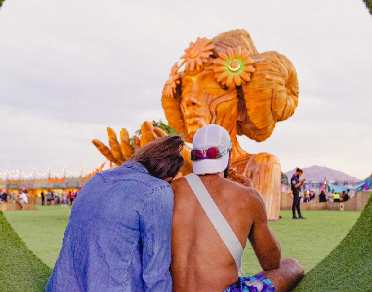 Fans sit in an interactive art installation on the Mesa at EDC Vegas 2021.
