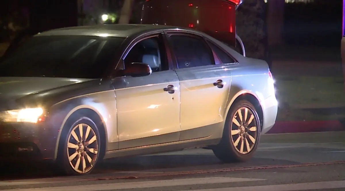 A bullet hole can be seen in the Audi allegedly used by the suspects.