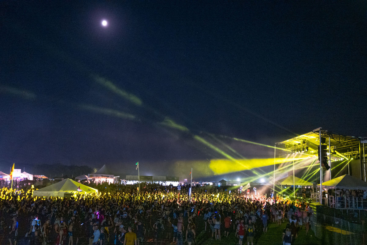 A full moon casting a mystical glow on the Starshine Stage.