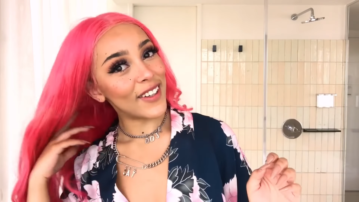 Doja Cat demonstrating a makeup routine for Vogue Taiwan in 2020.